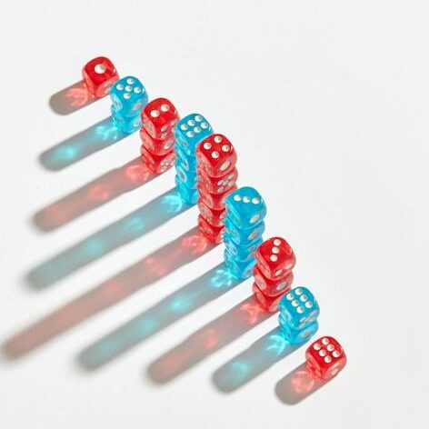 Studio Shoot of Red and Blue Dice Casting Shadow